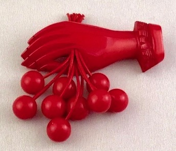 BP227 red bakelite hand with cherries pin